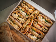 Sub Side’s Mixed Sub Platter – 2 Full Boxes (serves 10) features assorted ciabatta vegetarian subs packed with veggies, cheese, greens, and comes with extra signature ciabatta bread on the side.