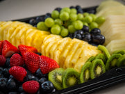 Sub Side’s Fresh Fruit Medley (serves 12/24) features neatly arranged sliced pineapple, kiwi, carved melon, strawberries, fresh seasonal berries, and mixed grapes.